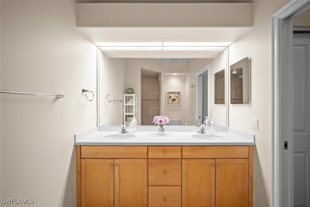 bathroom with a sink and double vanity