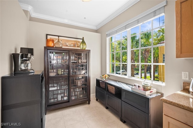 bar featuring ornamental molding and light tile patterned floors