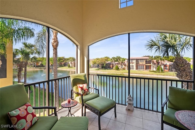 sunroom / solarium with a water view