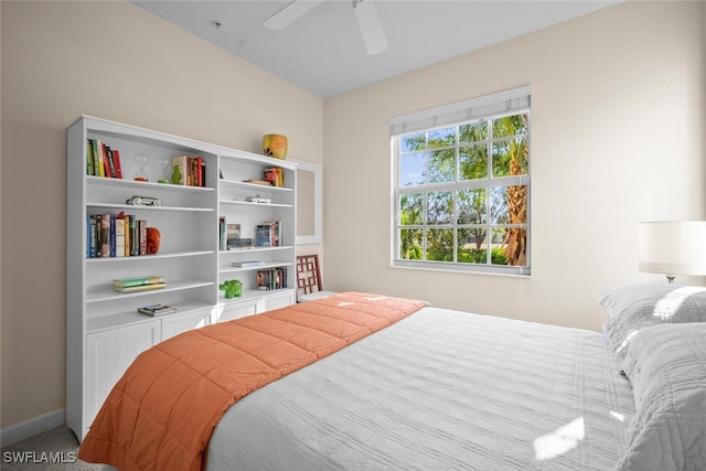 bedroom featuring baseboards and a ceiling fan
