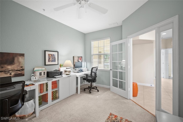 office space with carpet floors, a ceiling fan, visible vents, and baseboards