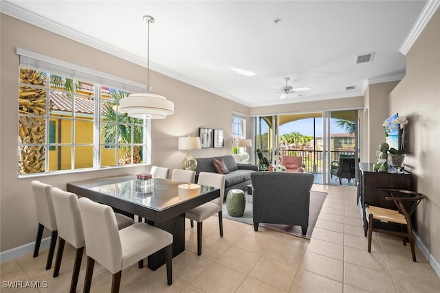 dining area with ceiling fan, visible vents, baseboards, and ornamental molding