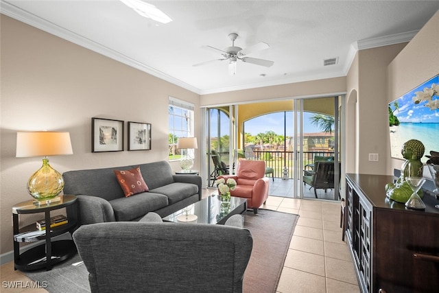 living room featuring light tile patterned floors, visible vents, ceiling fan, and crown molding