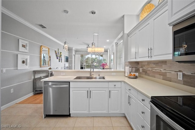 kitchen with crown molding, visible vents, appliances with stainless steel finishes, light tile patterned flooring, and a sink