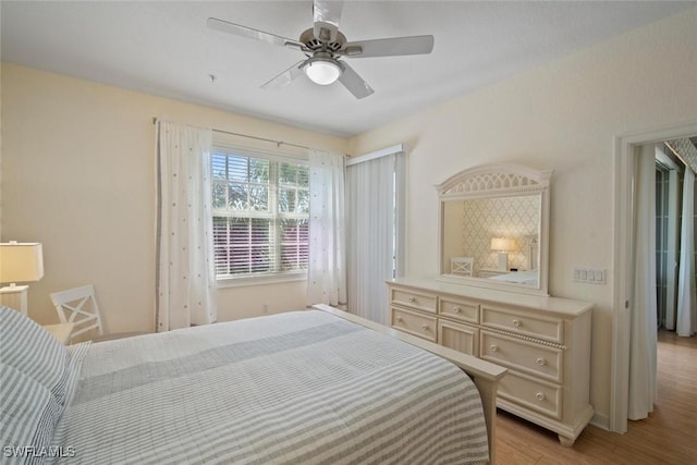 bedroom with light wood-style floors and ceiling fan