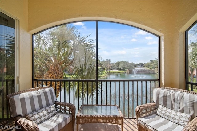 sunroom with a water view