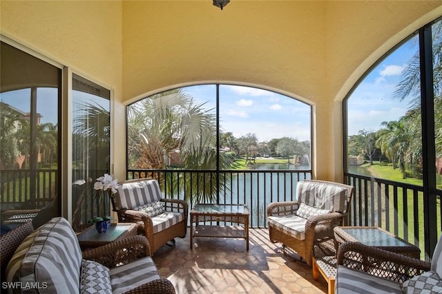 sunroom with a water view