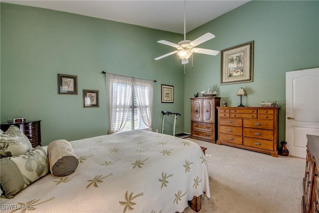 bedroom with carpet, high vaulted ceiling, and ceiling fan