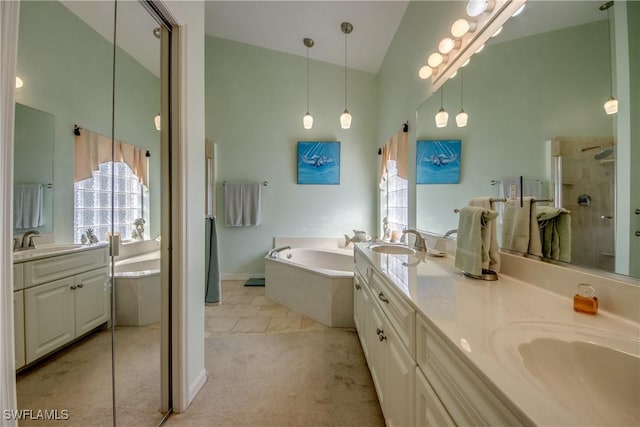 bathroom with a walk in shower, high vaulted ceiling, a sink, a bath, and double vanity