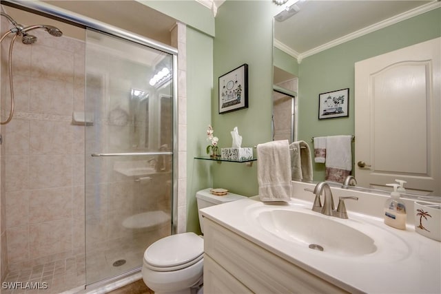 full bathroom featuring vanity, ornamental molding, a shower stall, and toilet