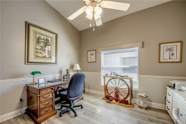 home office with light wood-style floors, vaulted ceiling, baseboards, and ceiling fan