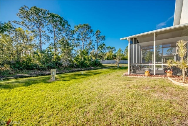 view of yard featuring a sunroom