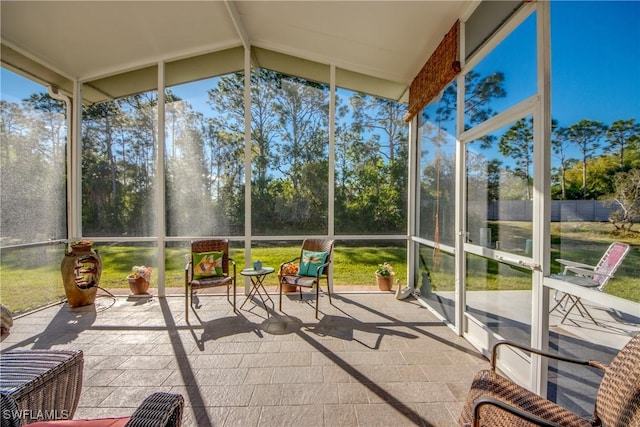 sunroom / solarium with lofted ceiling