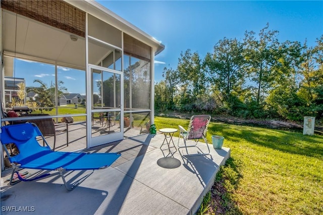 view of patio with a sunroom