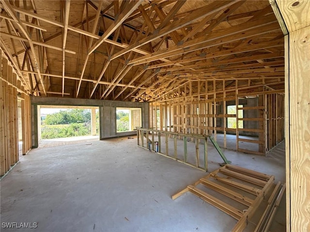 miscellaneous room with lofted ceiling