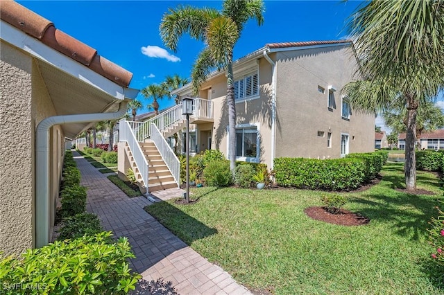 view of yard featuring stairway