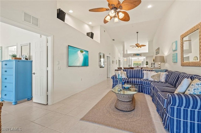 living room with light tile patterned floors, high vaulted ceiling, recessed lighting, a ceiling fan, and visible vents