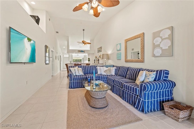 living room featuring ceiling fan, high vaulted ceiling, and tile patterned floors