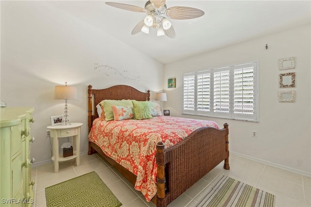 bedroom with light tile patterned floors, ceiling fan, and baseboards