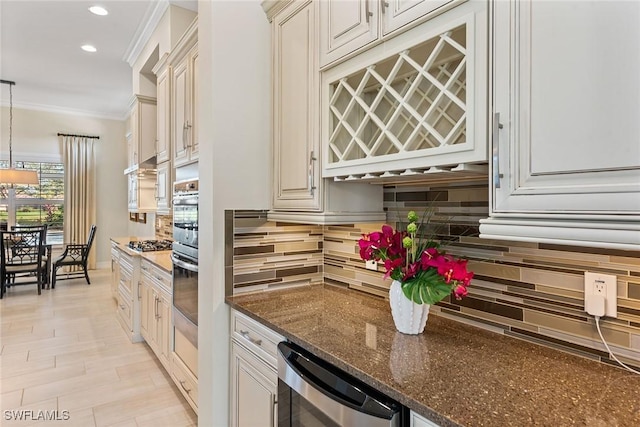 kitchen with beverage cooler, ornamental molding, appliances with stainless steel finishes, backsplash, and dark stone counters