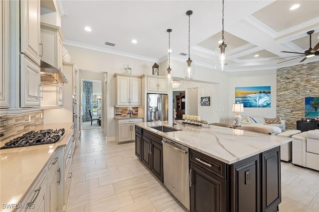 kitchen with under cabinet range hood, coffered ceiling, open floor plan, appliances with stainless steel finishes, and decorative backsplash