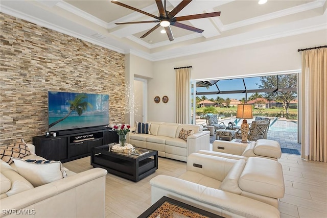 living area featuring crown molding, coffered ceiling, beamed ceiling, and a ceiling fan