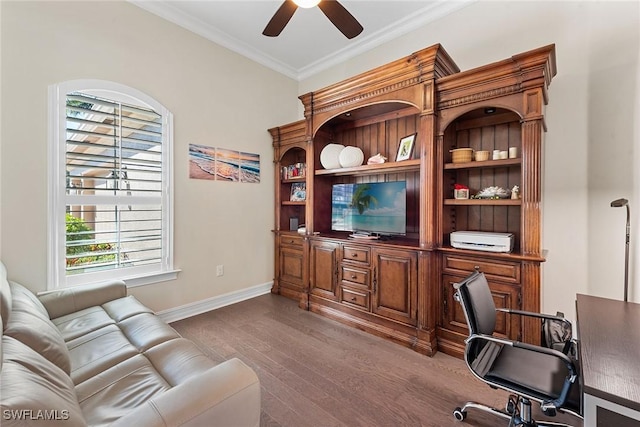 office space featuring ceiling fan, baseboards, wood finished floors, and crown molding