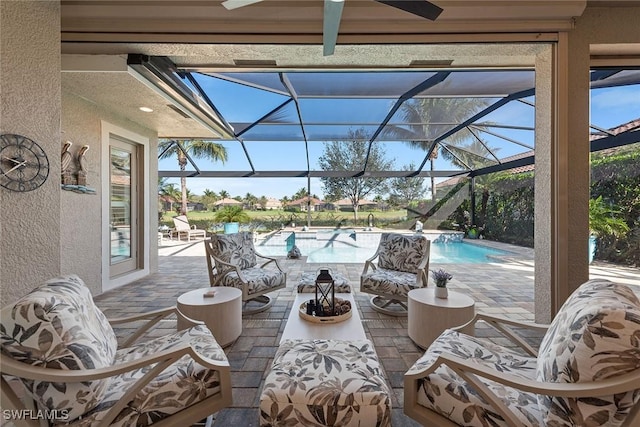 view of patio / terrace with an outdoor hangout area, glass enclosure, and an outdoor pool