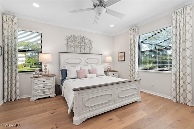 bedroom featuring light wood-style floors, recessed lighting, crown molding, and baseboards