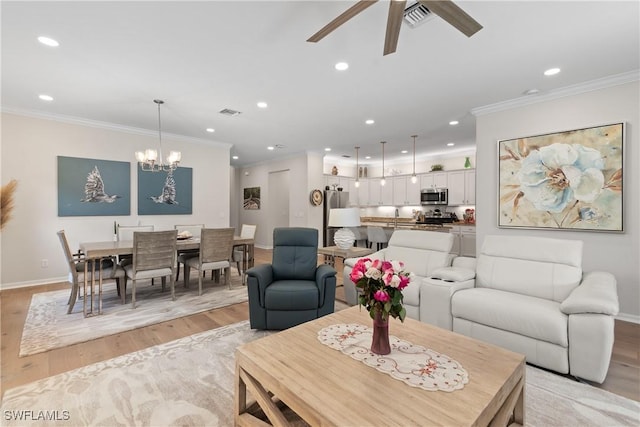 living area with light wood finished floors, recessed lighting, visible vents, and crown molding