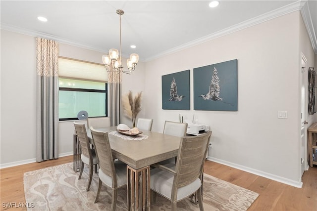 dining area with ornamental molding, baseboards, and wood finished floors