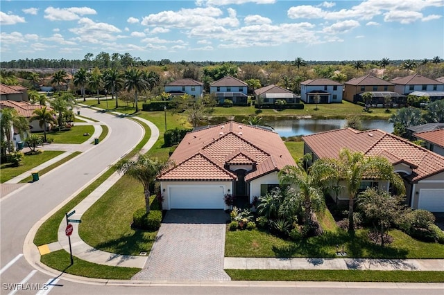 birds eye view of property featuring a residential view and a water view