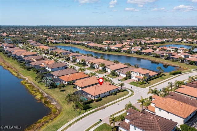 bird's eye view with a residential view and a water view