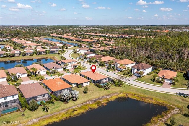 bird's eye view featuring a water view and a residential view