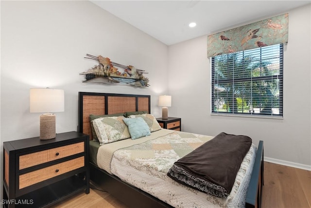 bedroom featuring recessed lighting, wood finished floors, and baseboards