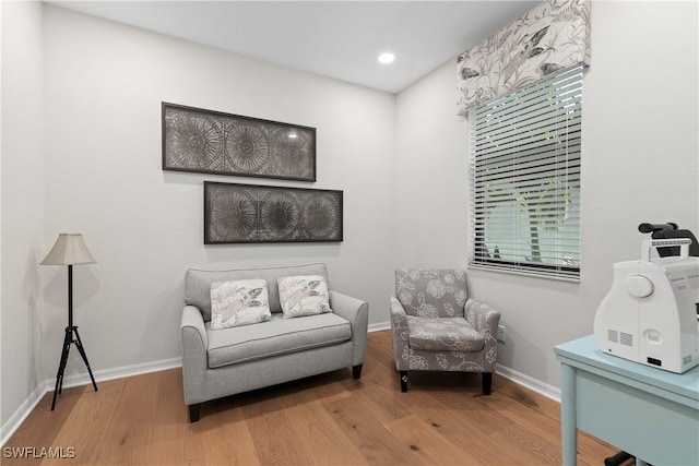 sitting room featuring recessed lighting, baseboards, and wood finished floors