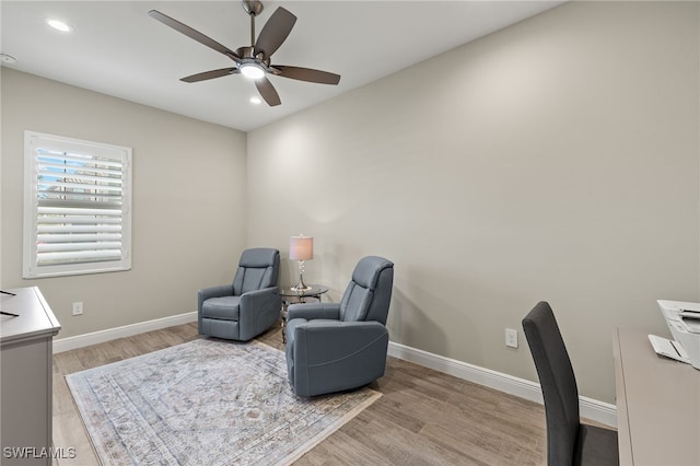 living area featuring recessed lighting, baseboards, ceiling fan, and light wood finished floors