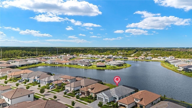 birds eye view of property featuring a water view and a residential view