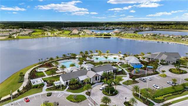 drone / aerial view featuring a water view and a residential view