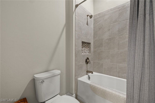 full bathroom with toilet and shower / bath combo with shower curtain