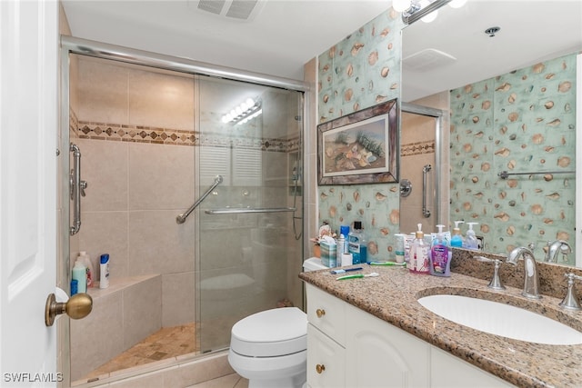 full bathroom with wallpapered walls, visible vents, toilet, vanity, and a shower stall