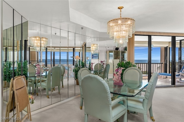 dining room with a healthy amount of sunlight, an inviting chandelier, and floor to ceiling windows