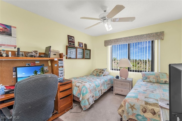 bedroom with carpet floors and a ceiling fan