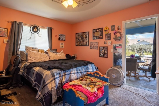 bedroom featuring access to outside, carpet, and a ceiling fan