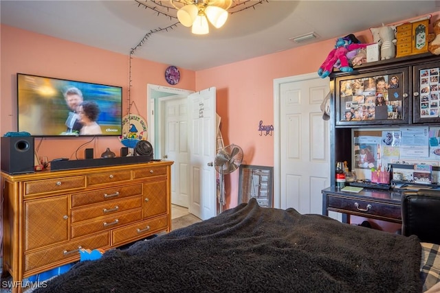 bedroom featuring a ceiling fan and visible vents