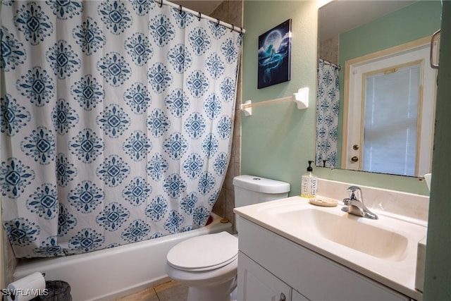 full bathroom with tile patterned floors, vanity, toilet, and shower / bath combo with shower curtain