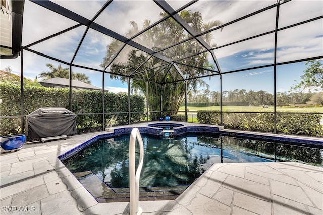 view of pool with grilling area, a patio area, a lanai, and a pool with connected hot tub