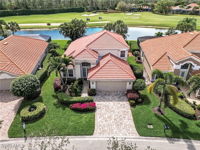 bird's eye view featuring view of golf course and a water view