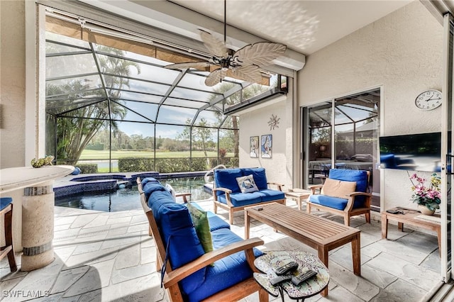 view of patio / terrace featuring an outdoor hangout area, glass enclosure, a pool with connected hot tub, and a ceiling fan