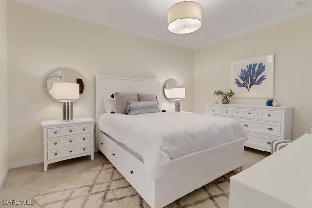 bedroom featuring ornamental molding and baseboards